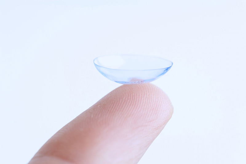 a picture of a contact lens on a finger