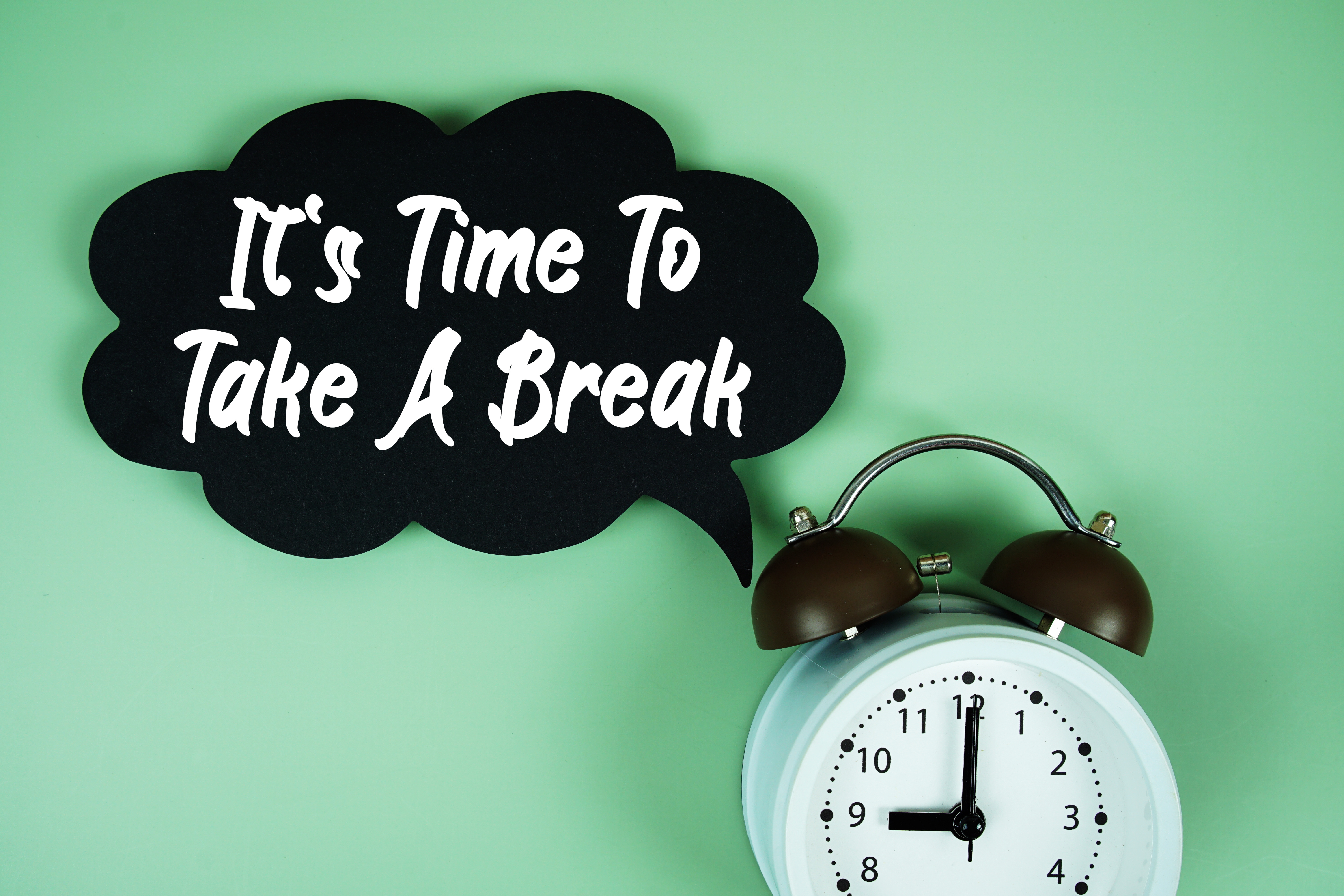 It’s time to take a break with a clock in background.