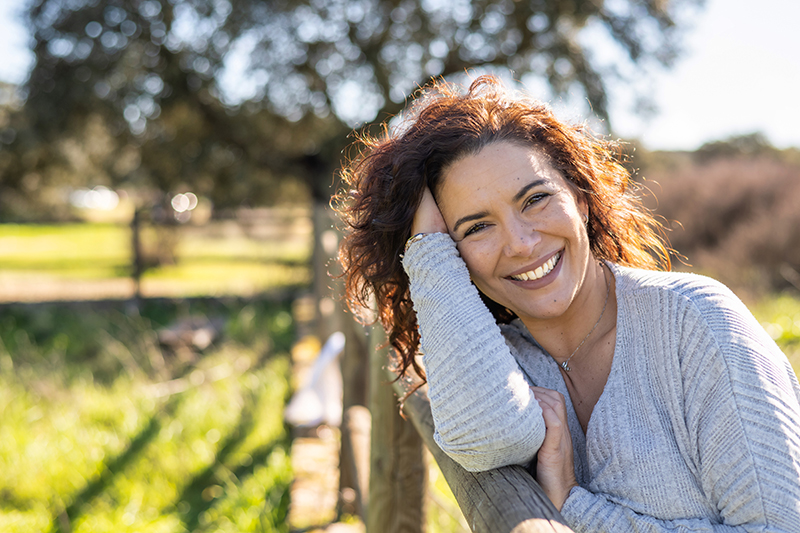 Woman enjoying a moment in the open field