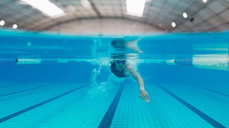 An image of a person swimming in the pool